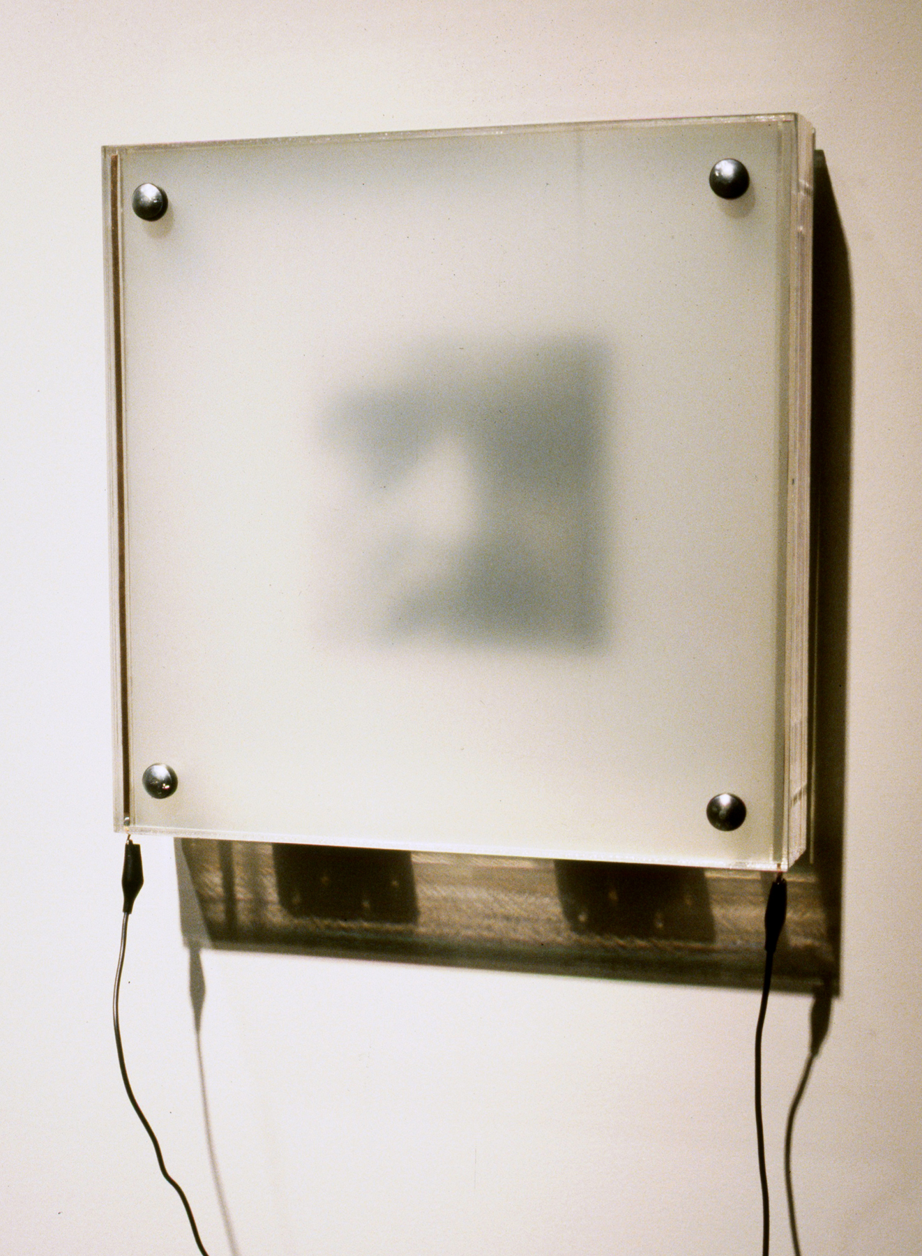 Jim Campbell, Photo of My Father: Custom electronics, glass, photograph, LCD material; 15” x 6” x 6” (1994–95)